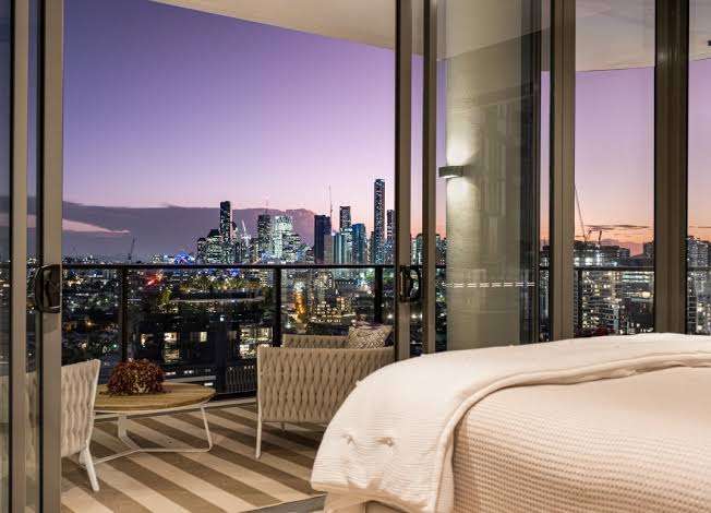 Modern incall escort apartment in Newstead, Brisbane with city skyline views at sunset